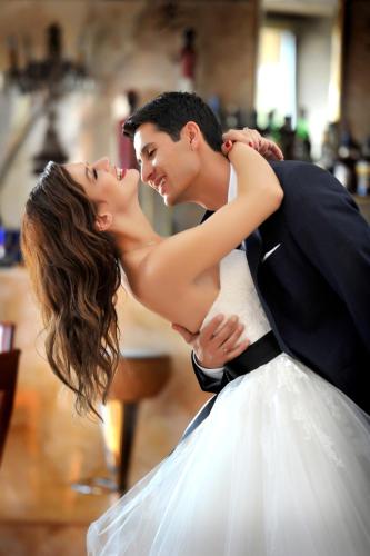 a bride and groom dancing at their wedding reception at Leventis Art Suites in Panayítsa