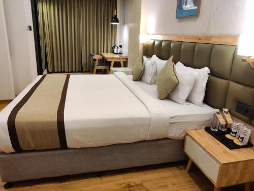 Postel nebo postele na pokoji v ubytování THE M HOTEL
