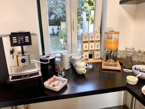 a kitchen with a counter with a blender on it at Hotel Markgraf in Klosterneuburg