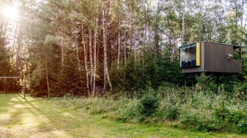 an object in the middle of a field with trees at Penzion Blanko in Nová Bystřice