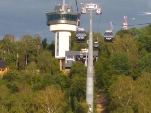 a gondola ride in front of a control tower at Dom Wschodzącego Słońca in Solina