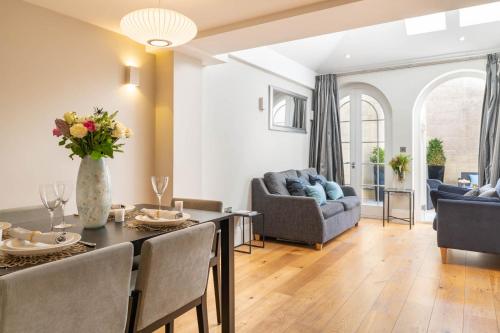 a living room with a dining table and a living room at Bath Circle in Bath