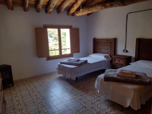 A bed or beds in a room at Casa Purujosa