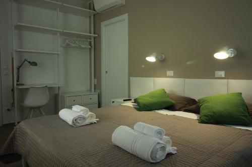 Giường trong phòng chung tại la casa in Ancona