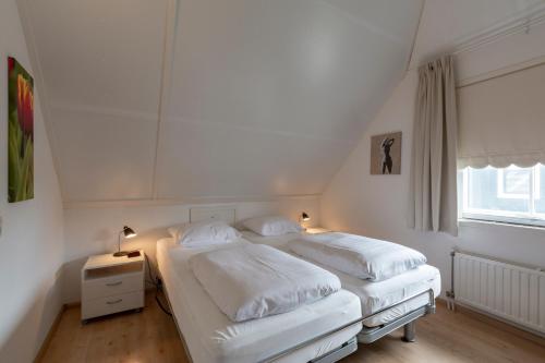 Postel nebo postele na pokoji v ubytování Buitenplaats 16 Callantsoog