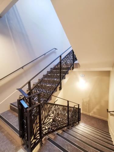 a staircase in a house with a skylight at Aux Ateliers in Miserey-Salines