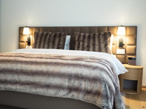 Un ou plusieurs lits dans un hébergement de l'établissement Radisson Blu Hotel Reussen, Andermatt