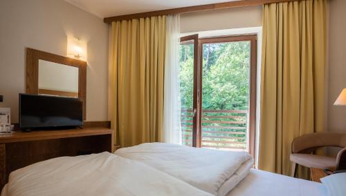 TV a/nebo společenská místnost v ubytování Hotel Arena Maribor