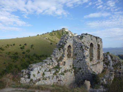 an old stone building on the side of a hill at Chambres d'Hôtes Domaine du Hameau Baylesse in Saint-Jean-dʼAigues-Vives