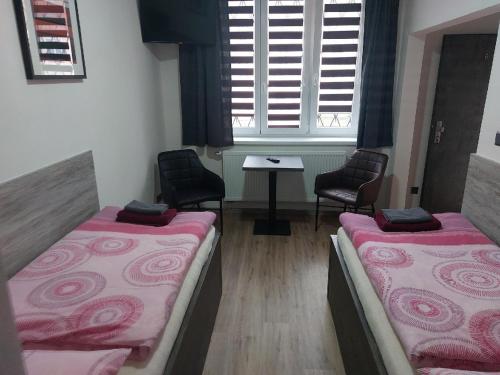 Ein Bett oder Betten in einem Zimmer der Unterkunft Penzion TOŠA