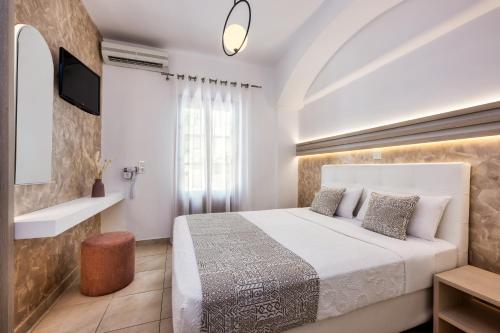 Postel nebo postele na pokoji v ubytování Petros Villa