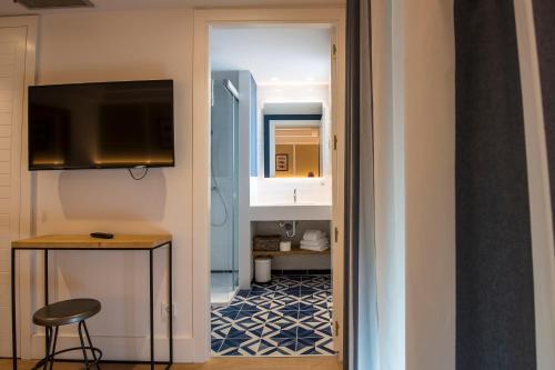a bathroom with a sink and a toilet at Hotel Els Pins in Platja  d'Aro