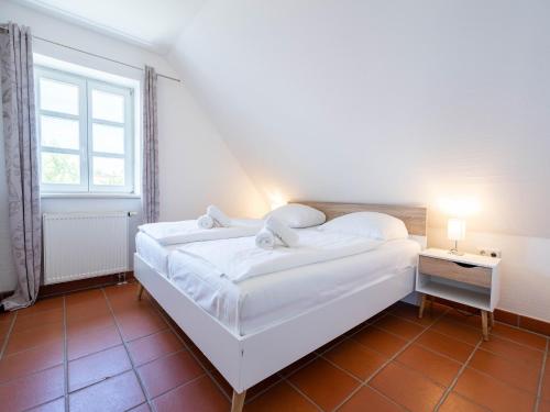 Postel nebo postele na pokoji v ubytování Feriendorf Rugana - Klassik Appartement mit 1 Schlafzimmer D57