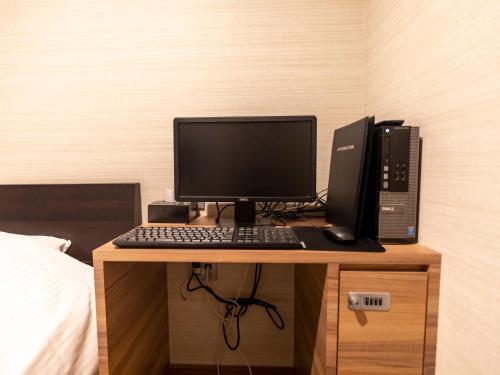 TV a/nebo společenská místnost v ubytování Tabist Hotel Smart Sleeps Oita Station