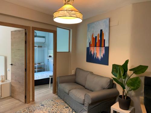 a living room with a couch and a bedroom at Home SEA&DREAMS Beach in Calpe