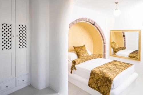 Postel nebo postele na pokoji v ubytování Pegasus Suites & Spa