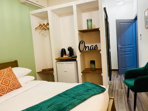 Postel nebo postele na pokoji v ubytování Moya Résidence by MD