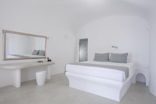 Postel nebo postele na pokoji v ubytování Pegasus Suites & Spa