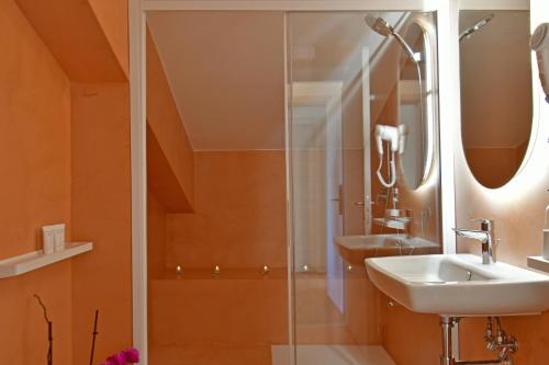 a bathroom with a sink and a shower at San Anton Hotel in Trecastagni