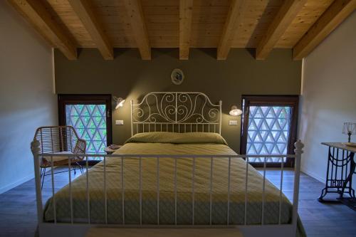 Кровать или кровати в номере Casale San Pietro