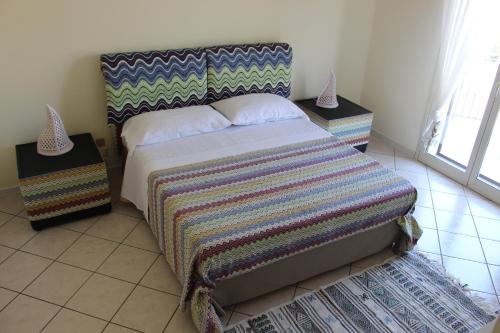 Posteľ alebo postele v izbe v ubytovaní Halawa Room Giardini Naxos