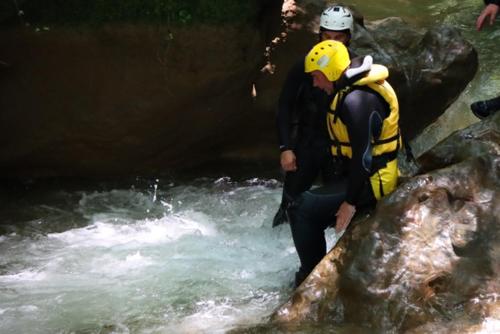 a man standing on a rock in a river at B&B Rox e Claudia in Lugnola