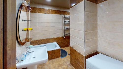 a bathroom with a sink and a shower at Yerevan City Center apartment in Yerevan