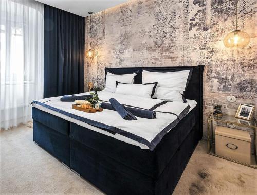 A bed or beds in a room at NEW Design & High Standard Apt from 16th Century in Old Town