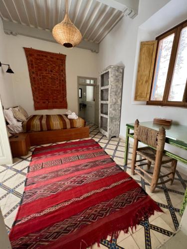 Postel nebo postele na pokoji v ubytování Riad Al Zahia