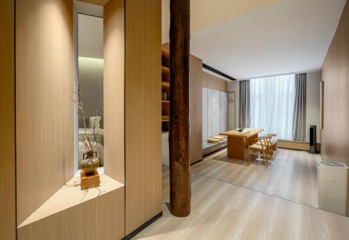a living room and dining room with a table at Shenzhen ALLIN Space to time in Shenzhen