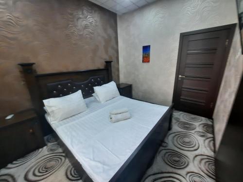 Säng eller sängar i ett rum på Diamond Hotel Dushanbe