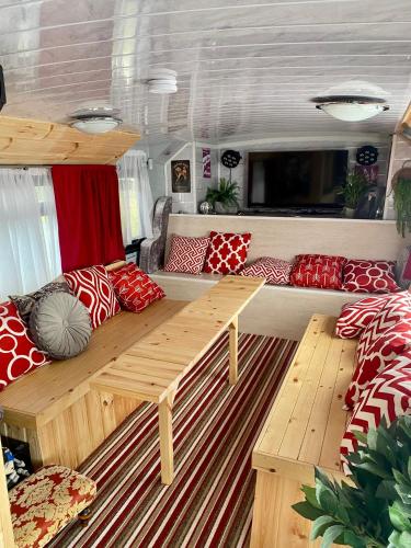a living room with a couch and a table at Double Decker Bus in Aberystwyth