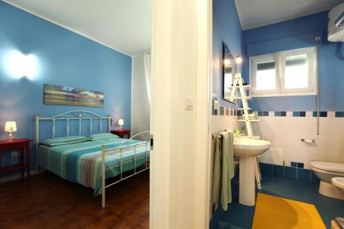 Ένα ή περισσότερα κρεβάτια σε δωμάτιο στο A Casa di Teresa