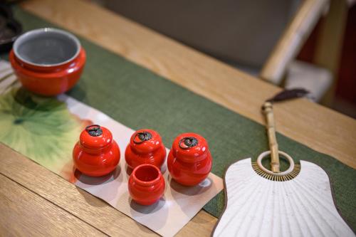 a group of red dominoes on a table at Shenzhen ALLIN Space to time in Shenzhen