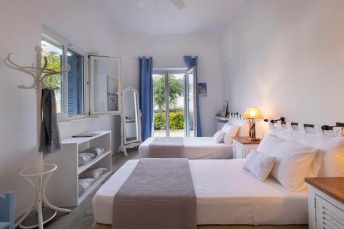 A bed or beds in a room at Seabreeze house by the sea