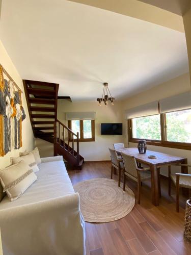 a living room with a couch and a table at Esperides Parga Studios in Parga