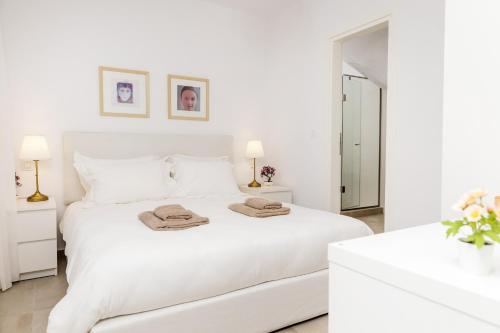 Ένα ή περισσότερα κρεβάτια σε δωμάτιο στο Naxian Resort