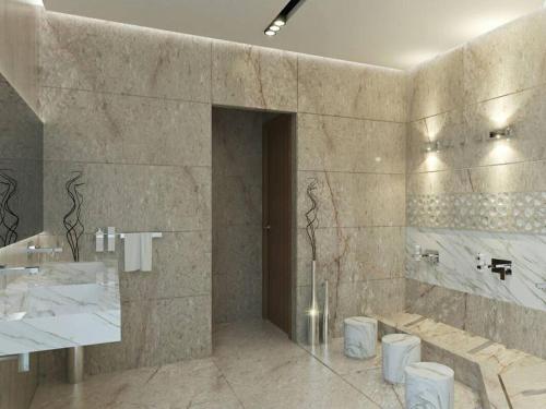 a bathroom with a sink and two toilets in it at Charming 1-Bed Apartment in Tunis close to centre in Tunis