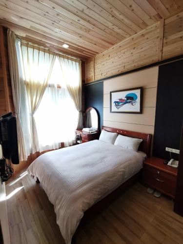 Una cama o camas en una habitación de Dreamtown