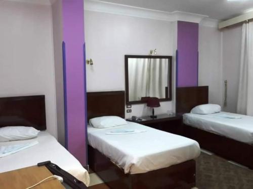 Un pat sau paturi într-o cameră la Dream Hotel