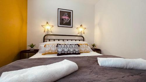 a bedroom with a bed with two pillows on it at She's Electric in Blandford Forum