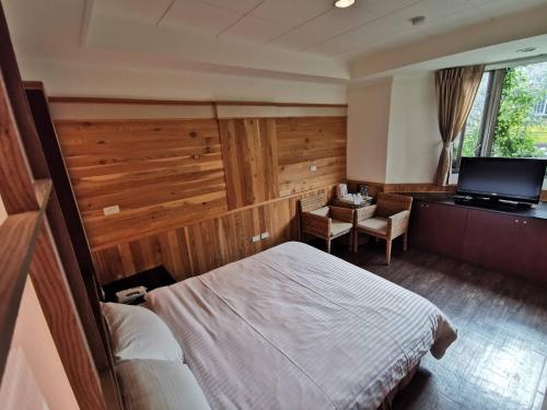 Una cama o camas en una habitación de Dreamtown