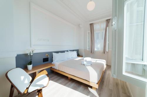 Posteľ alebo postele v izbe v ubytovaní Agora Athens Suites