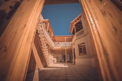 a view of a hallway of a building at Oqilanur Guest House in Khiva