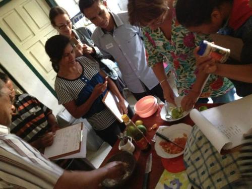 a group of people standing around a table with food at FabHotel Prime Empire in Amritsar