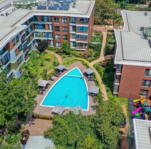 an overhead view of an apartment complex with a swimming pool at WOW Property Accra the pearl in city in Accra