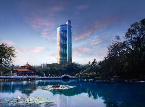 a tall building in the middle of a large lake at Shangri-La Far Eastern Tainan in Tainan