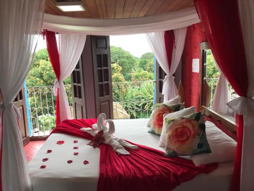 a bedroom with a bed with a bunny on it at Pousada Alto Astral in Olinda