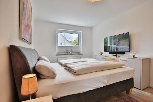 En eller flere senge i et værelse på Haus am Seehof Ferienwohnung Ostseeliebe