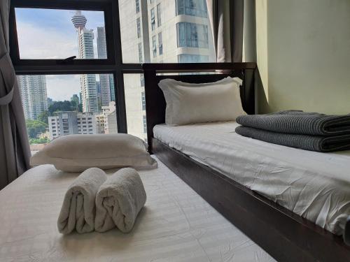 Un ou plusieurs lits dans un hébergement de l'établissement The Robertson Bukit Bintang by WEEGO Homes